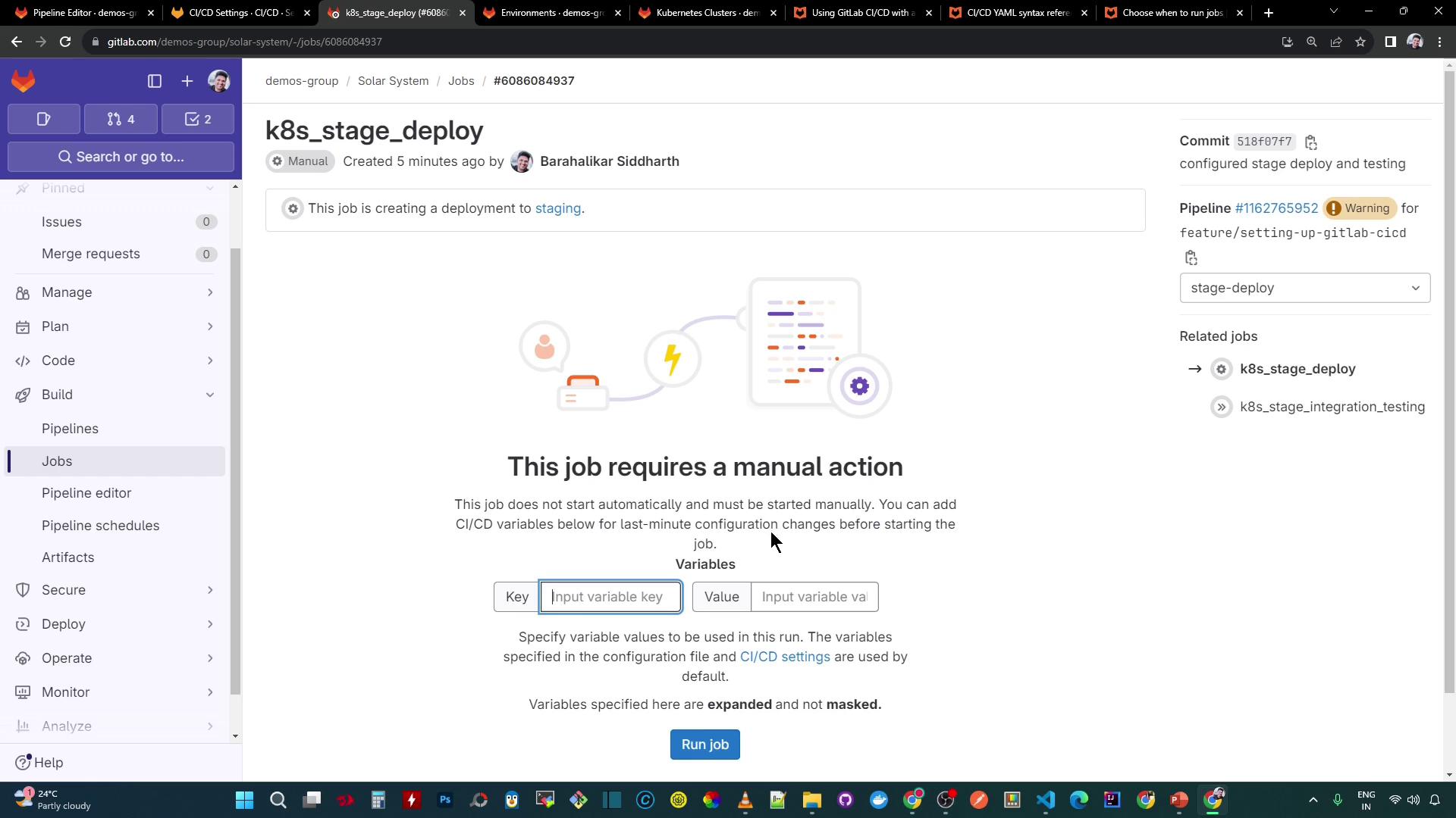 The image shows a GitLab CI/CD job interface for "k8s_stage_deploy," indicating that the job requires manual action to start. It allows users to input CI/CD variables before running the job.