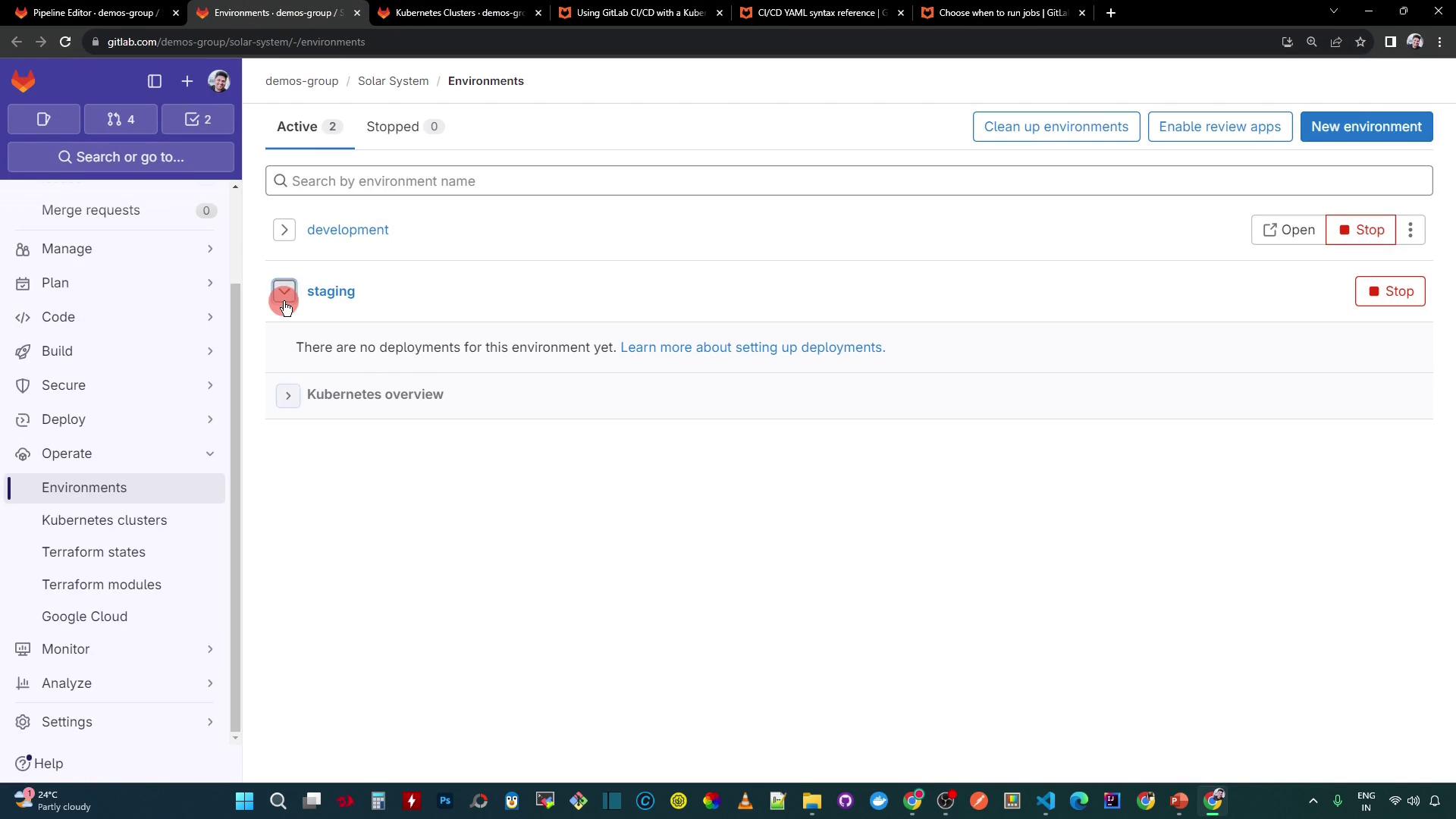 The image shows a GitLab interface displaying the "Environments" section with two active environments: "development" and "staging." There are no deployments for the "staging" environment, and options to manage environments are visible.