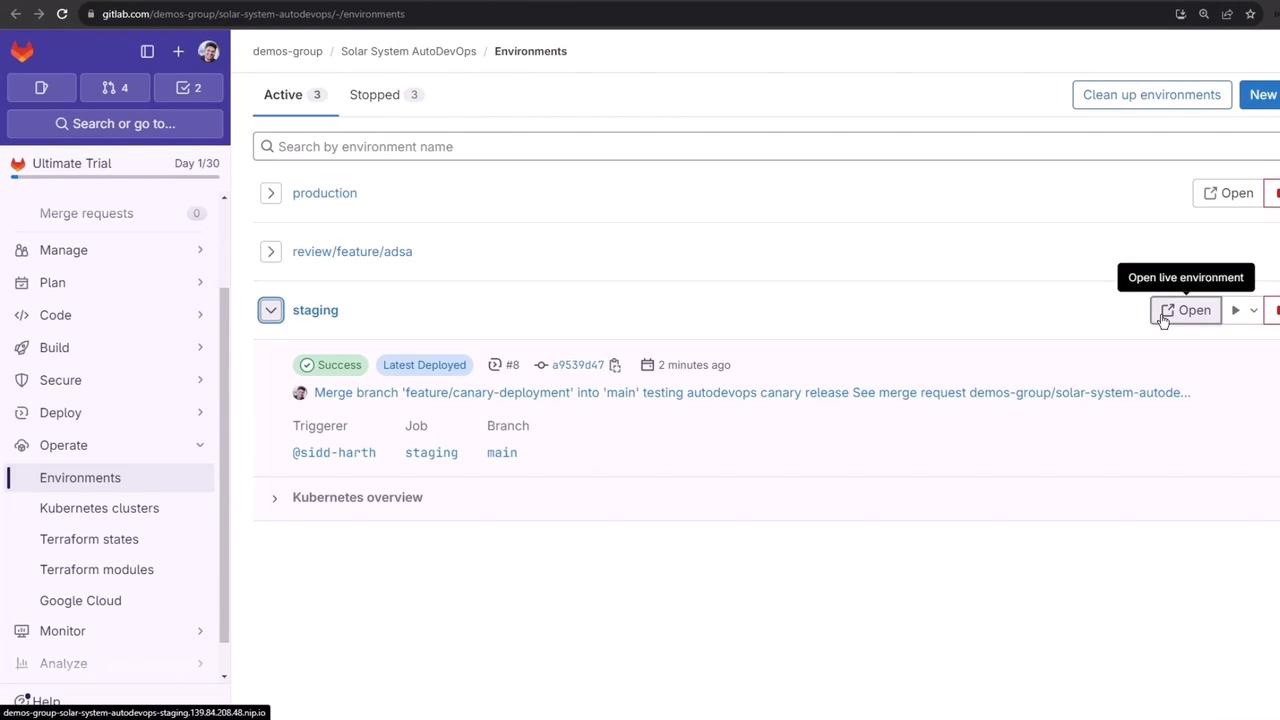 The image shows a GitLab interface displaying the "Environments" section with active environments like "production," "review/feature/adsa," and "staging." It highlights a successful deployment in the "staging" environment with options to open the live environment.