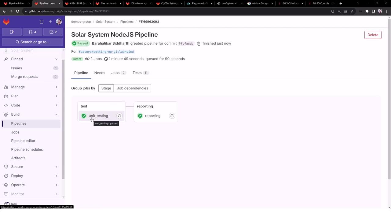 The image shows a GitLab CI/CD pipeline interface for a NodeJS project named "Solar System," with two jobs, "unit_testing" and "reporting," both marked as passed.
