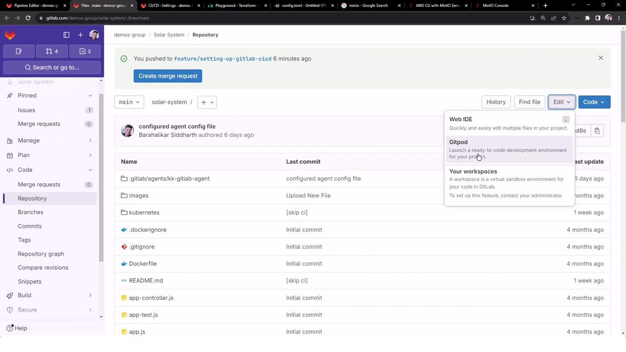 The image shows a GitLab repository interface with a list of files and folders, along with options for editing and viewing commit history. A tooltip is visible, providing options for using Web IDE, Gitpod, and workspaces.