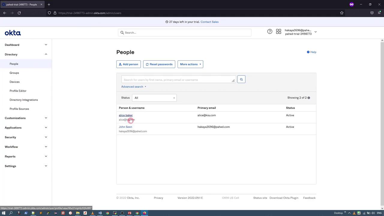 The image shows an Okta admin dashboard displaying a list of users with their usernames, primary emails, and statuses. The interface includes options to add a person, reset passwords, and perform more actions.