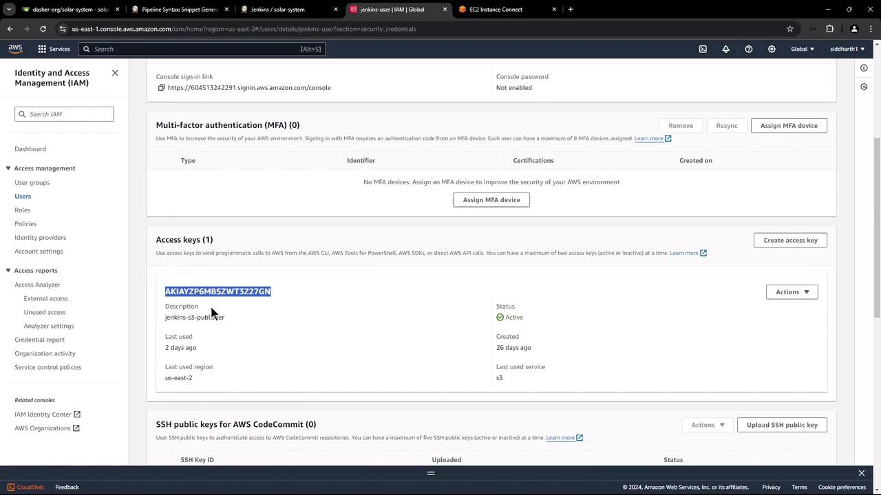 The image shows an AWS Identity and Access Management (IAM) console screen, displaying user details, including access keys and multi-factor authentication settings.