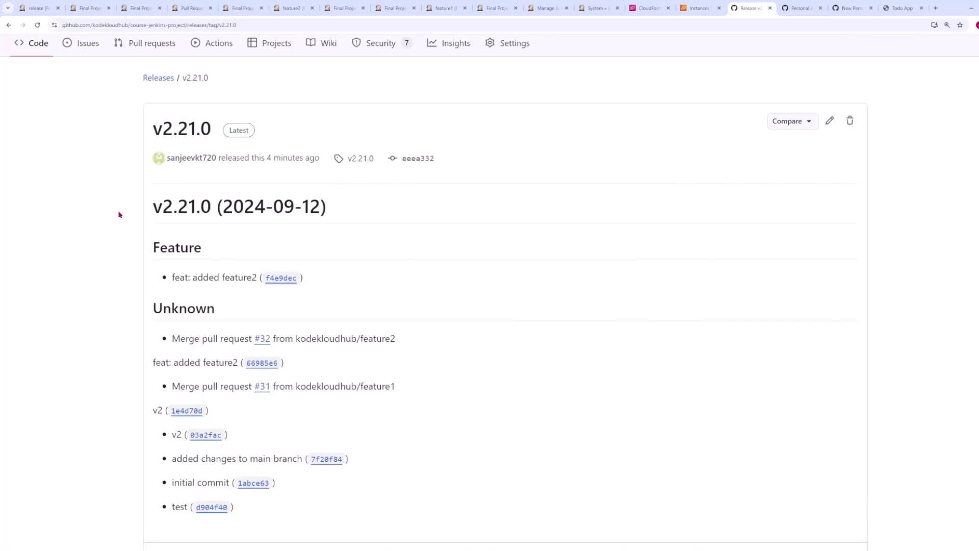 The image shows a GitHub release page for version 2.21.0, detailing features and merged pull requests.