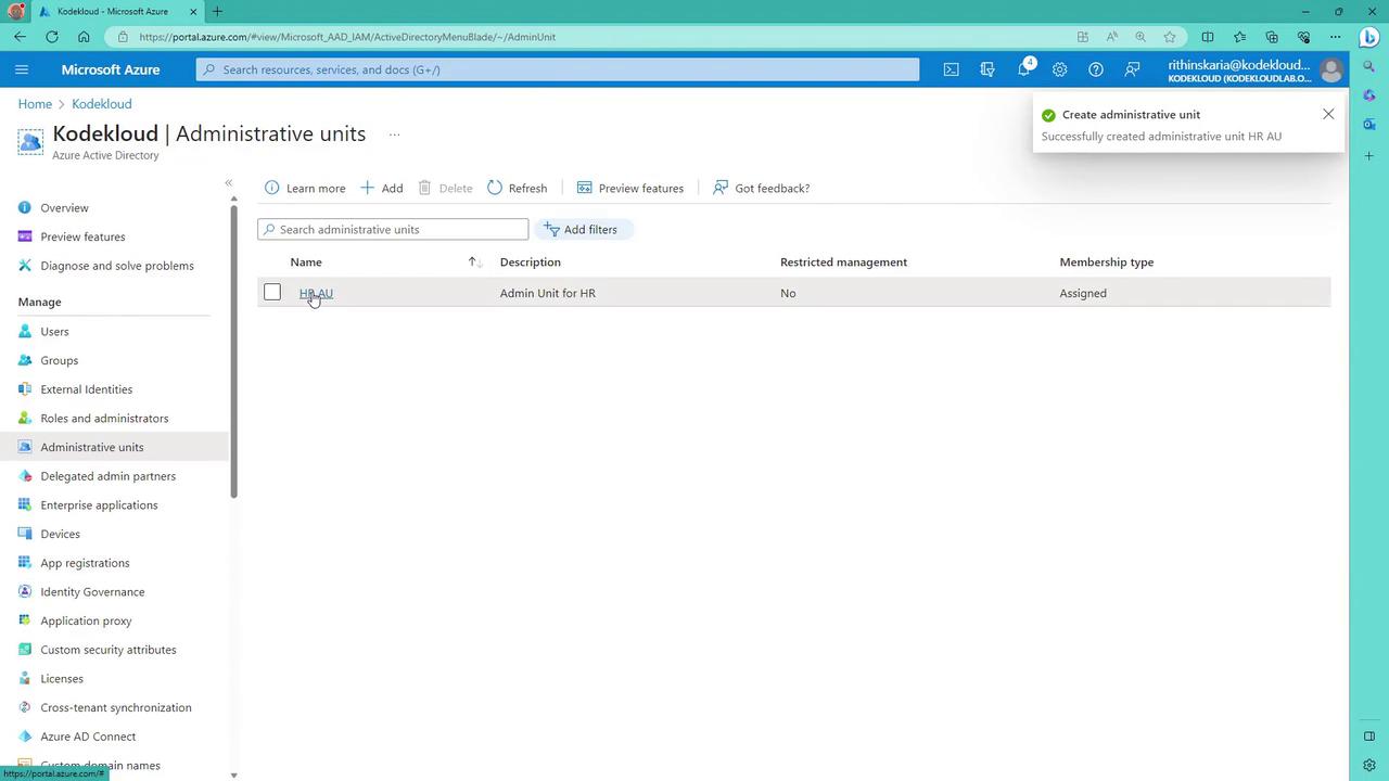 The image shows a Microsoft Azure portal interface displaying the "Administrative units" section, with an administrative unit named "HR AU" listed. A notification confirms the successful creation of this administrative unit.