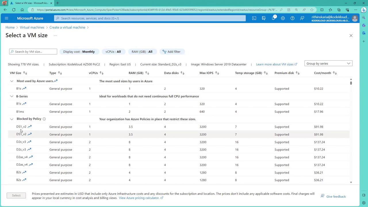 The image shows a Microsoft Azure portal page for selecting a virtual machine (VM) size, displaying various VM options with details like type, vCPUs, RAM, and cost per month. Some VM sizes are marked as blocked by policy, indicating restrictions set by the organization.