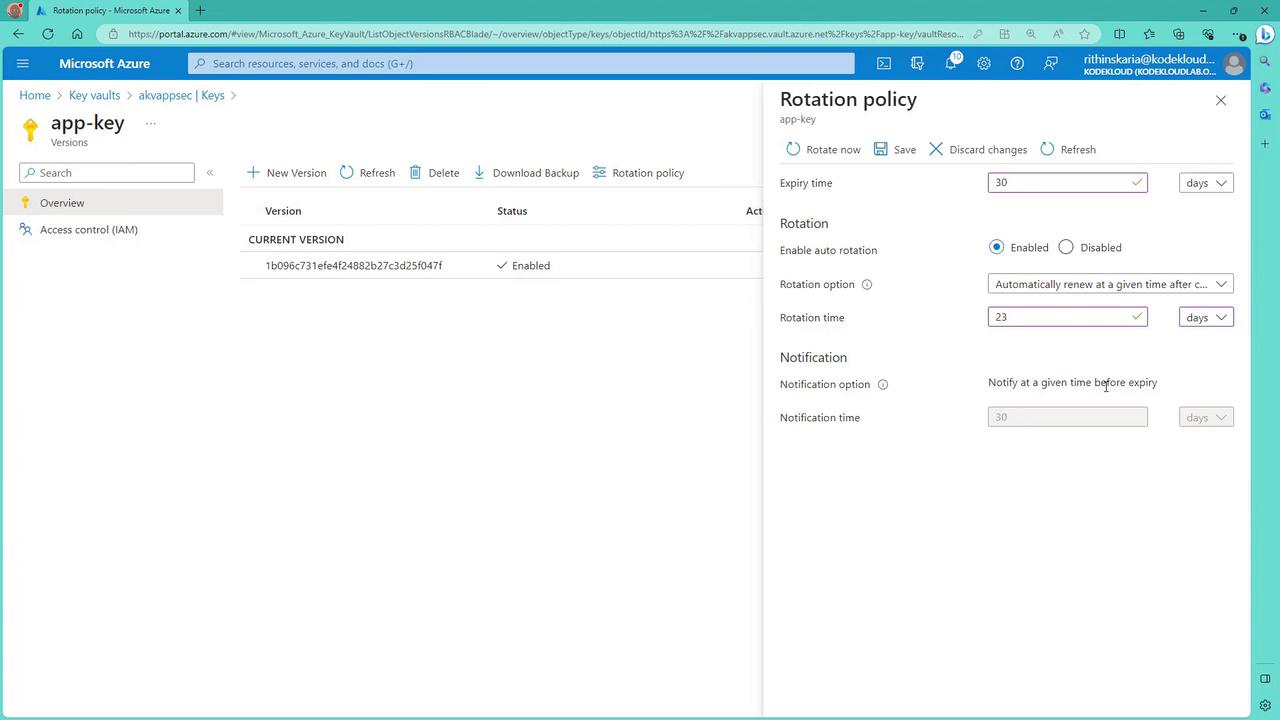 The image shows a Microsoft Azure portal interface displaying the details of a key vault named "app-key," including its version and status. On the right, there is a "Rotation policy" panel with options for setting expiry time, enabling auto-rotation, and configuring notifications.