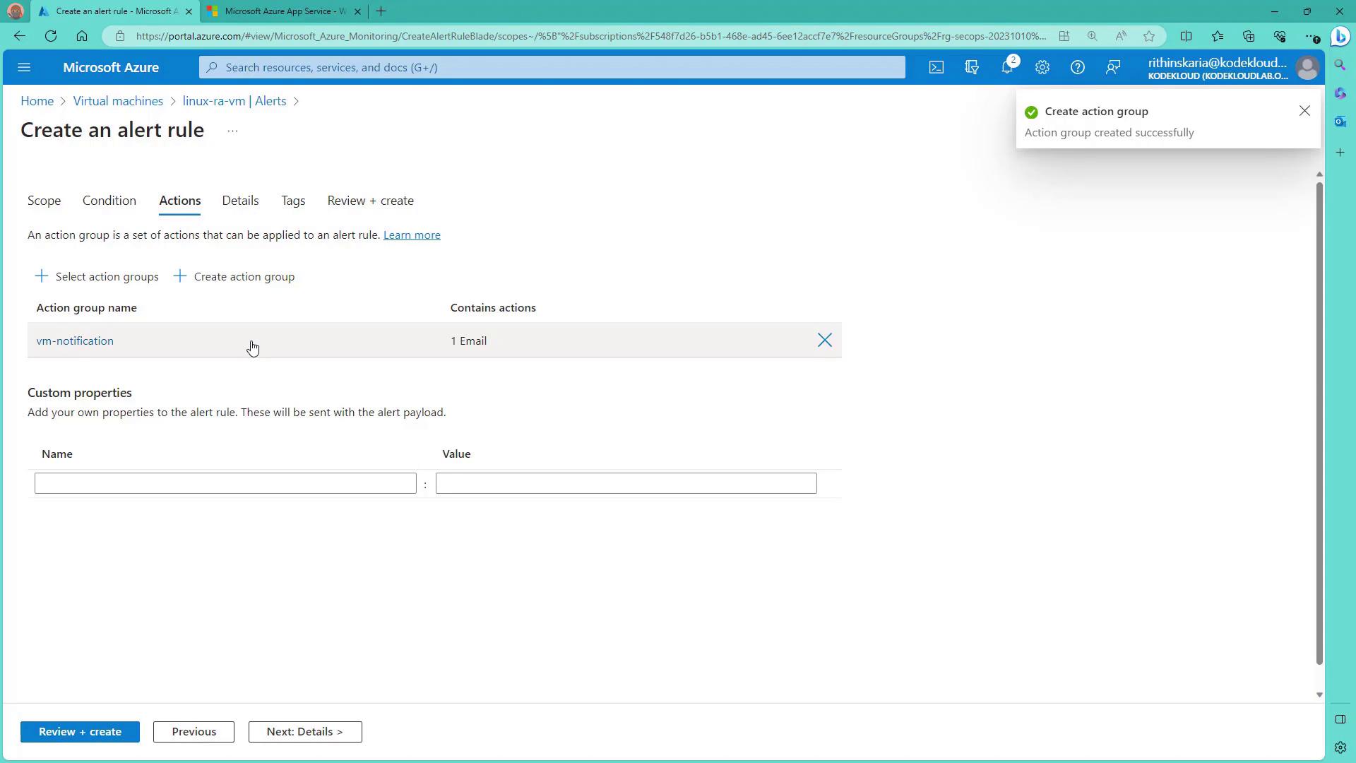 The image shows a Microsoft Azure portal screen for creating an alert rule, specifically on the "Actions" tab, where an action group named "vm-notification" containing an email action is listed. A notification confirms the successful creation of an action group.