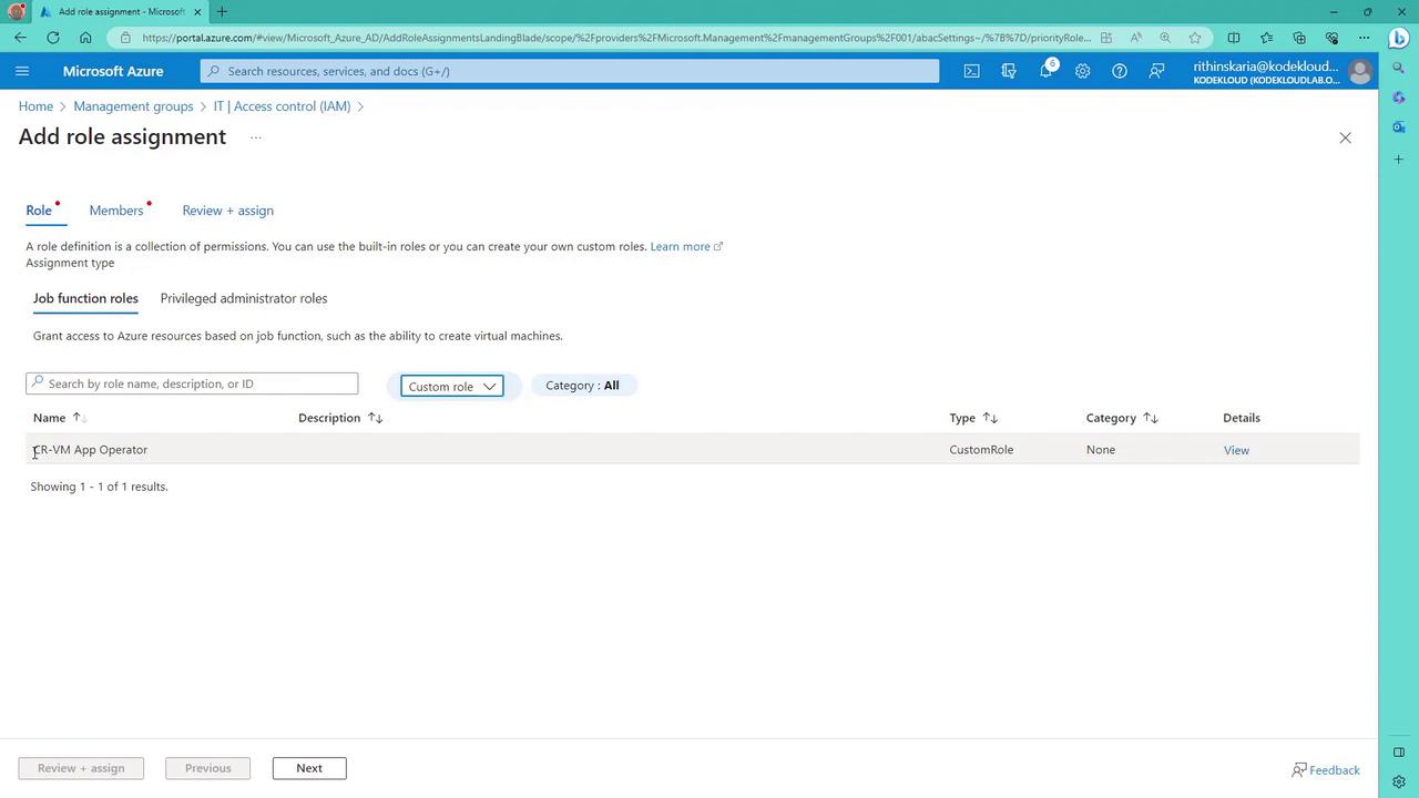 The image shows a Microsoft Azure portal page for adding a role assignment, displaying options for job function roles and a custom role named "ER-VM App Operator."