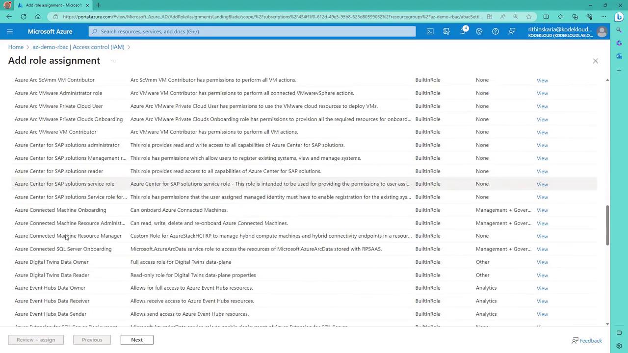 The image shows a Microsoft Azure portal page for adding role assignments, listing various roles with descriptions, types, and options to view details.