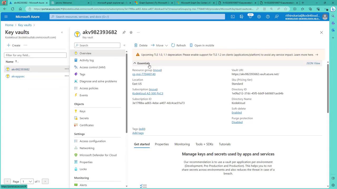 The image shows a Microsoft Azure portal interface displaying details of a Key Vault named "akv982393682," including its essentials, settings, and monitoring options.