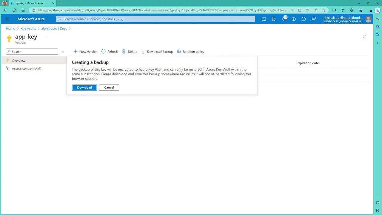 The image shows a Microsoft Azure Key Vault interface with a pop-up message about creating a backup for a key, offering options to download or cancel.