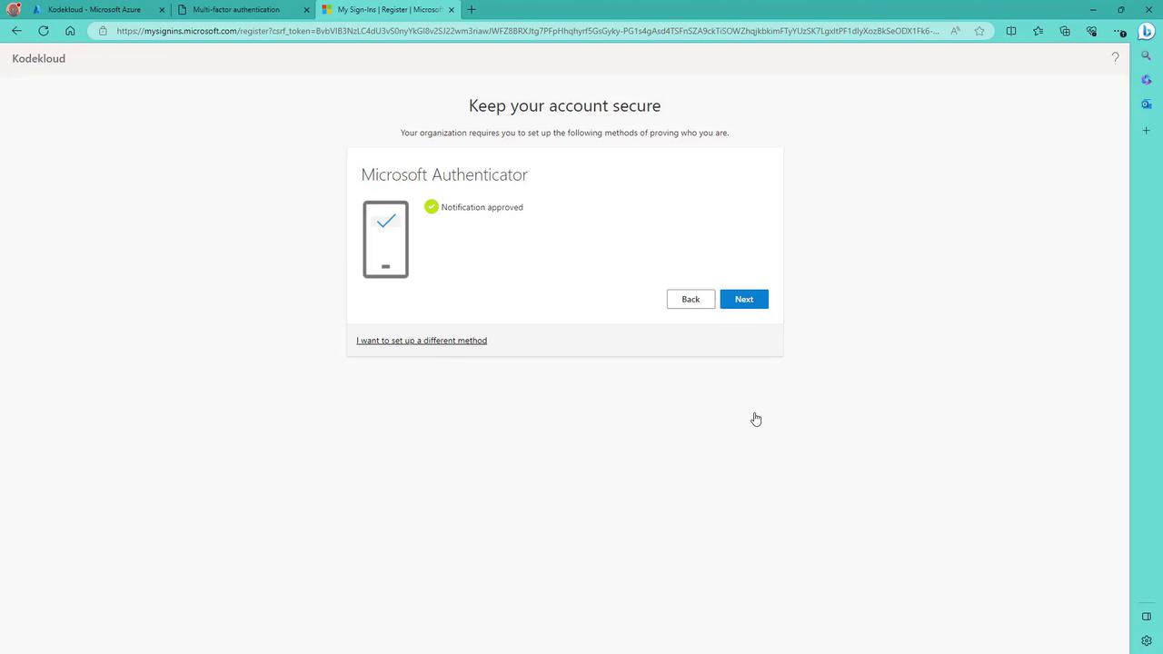 The image shows a Microsoft Authenticator setup page indicating that a notification has been approved. There are options to go back or proceed to the next step.
