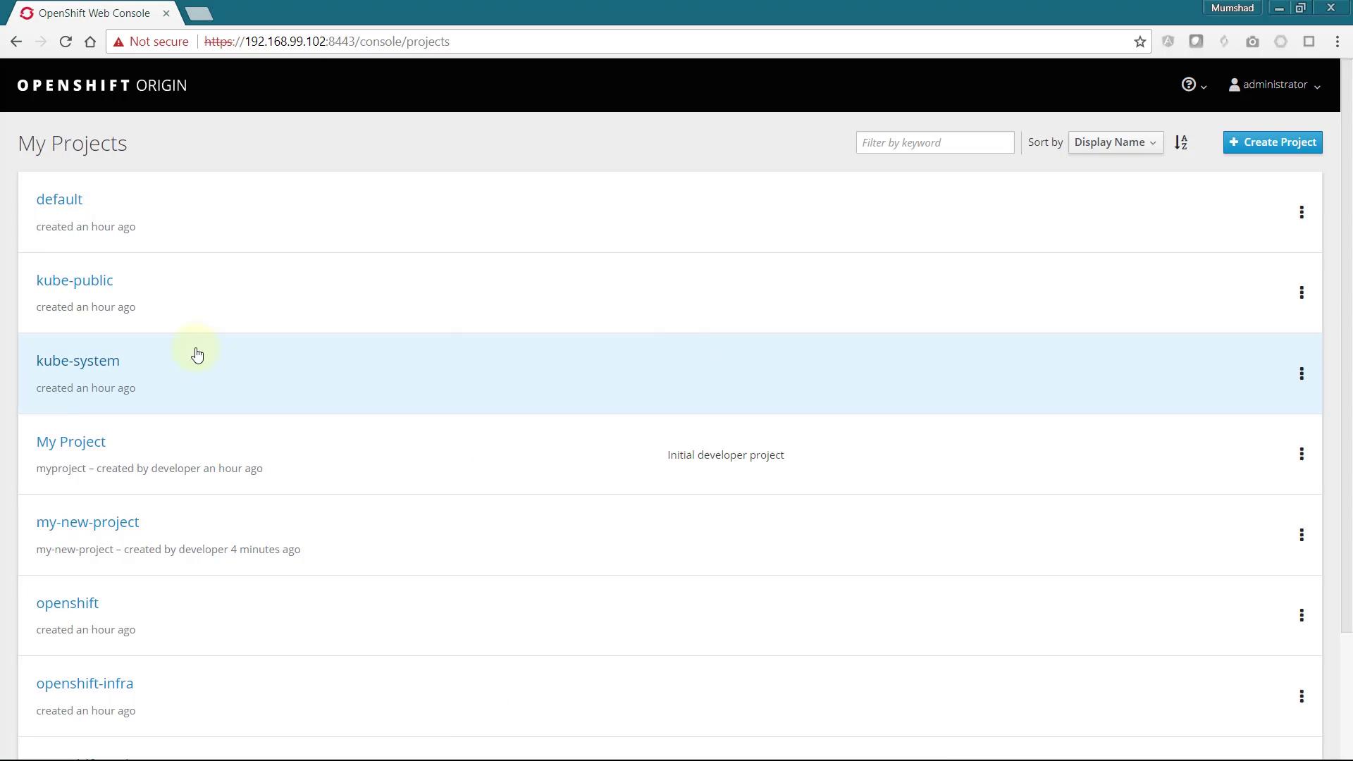 The image shows the OpenShift Web Console displaying a list of projects, including "default," "kube-public," "kube-system," and others, with options to filter and sort them.